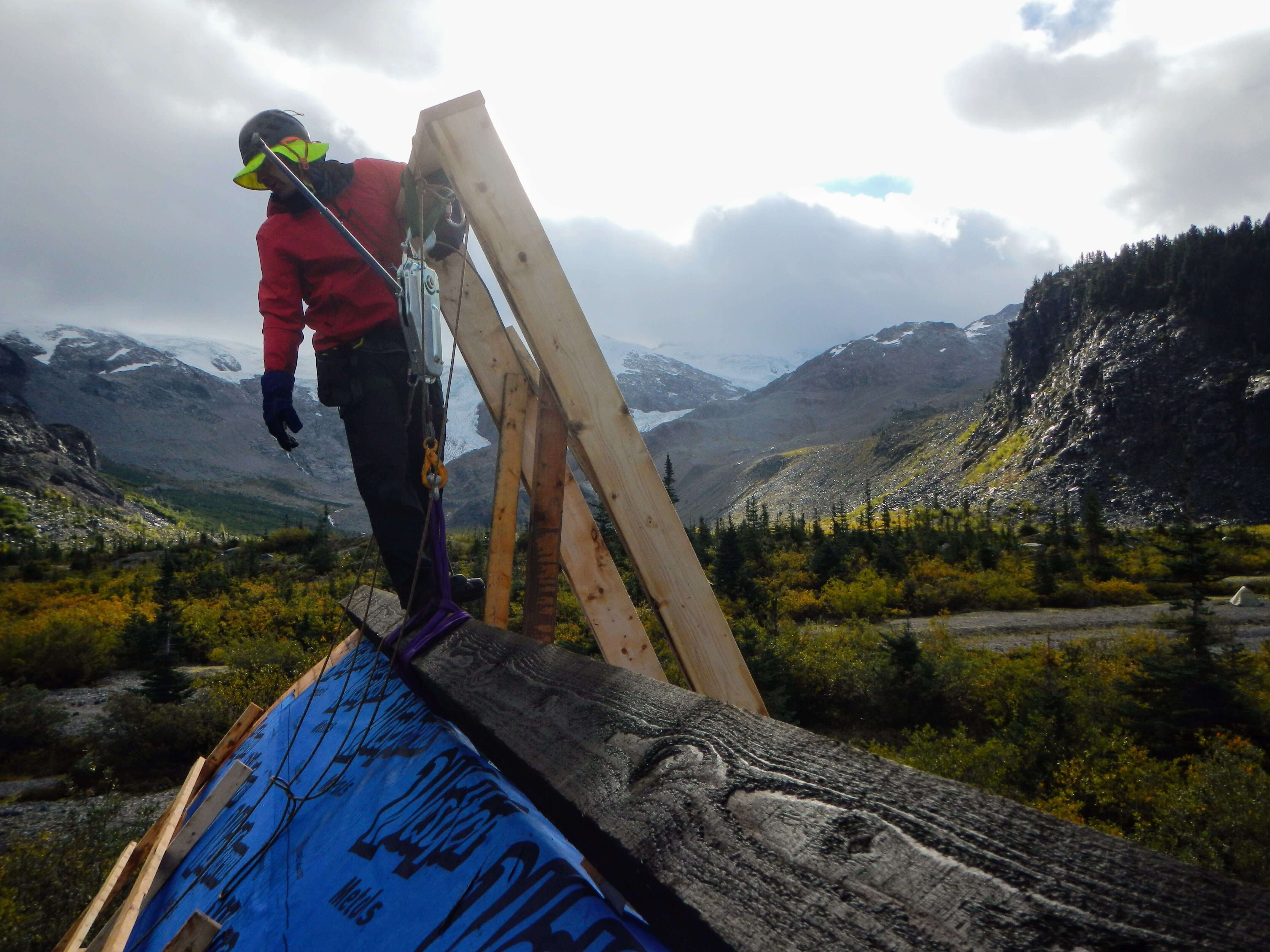 Jeff standing on the center beam after it was raised into place. PC: Aaron Lee