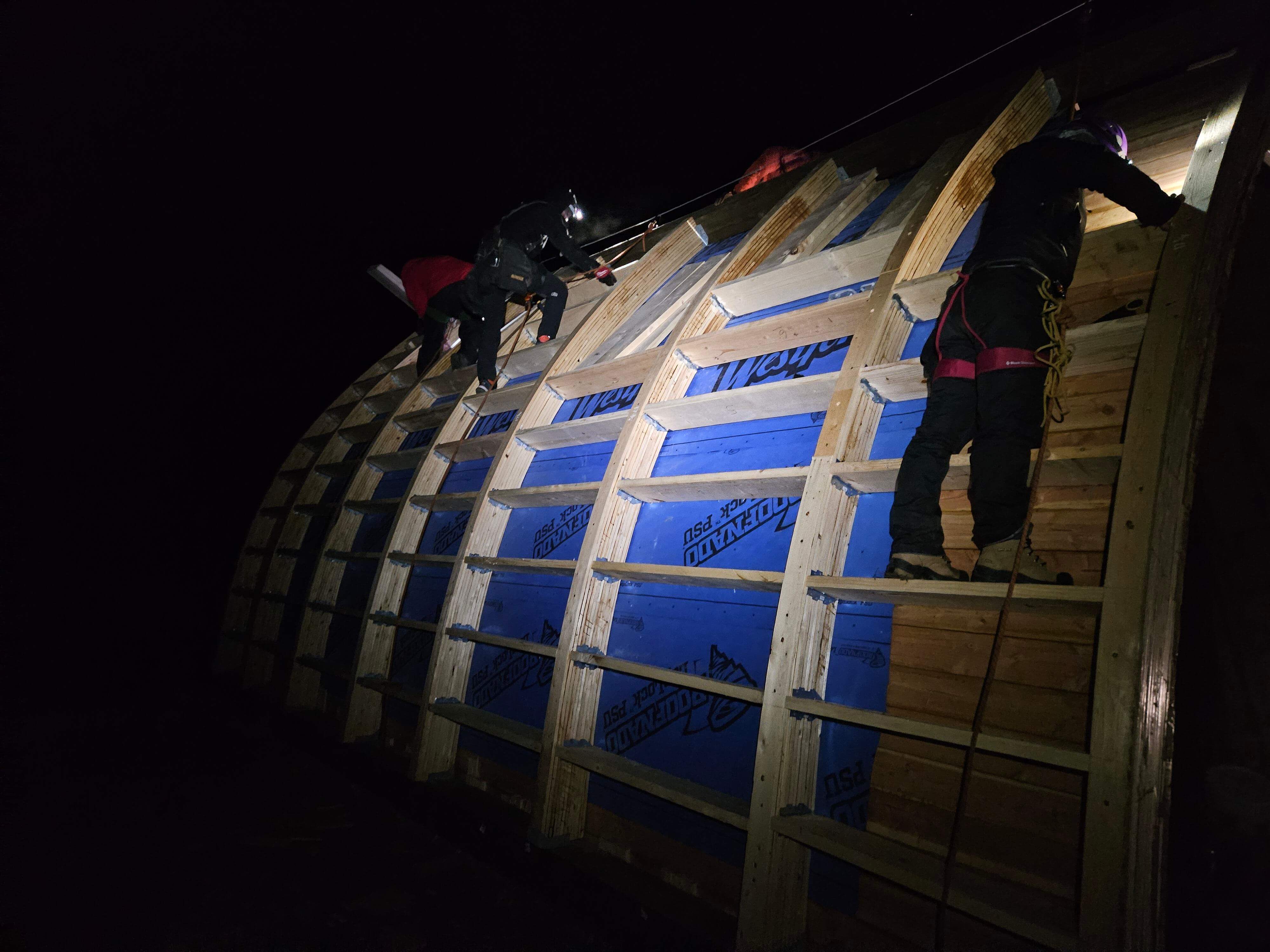 The team hammers joists into the night. PC: Connor Jakes